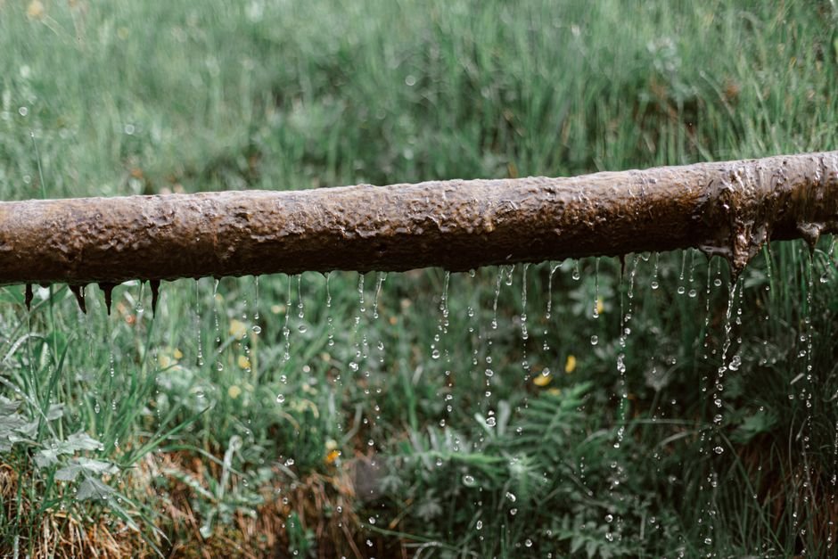 High-pressure borewell flushing clearing a blocked pipe